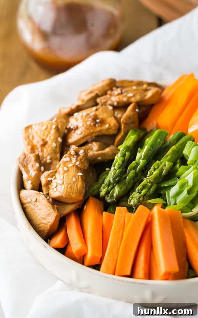 Spring Chicken and Asparagus Salad 2 Chicken & Asparagus Salad - A delicious spring salad packed with veggies, seasoned chicken and a tangy Sesame Ginger dressing.