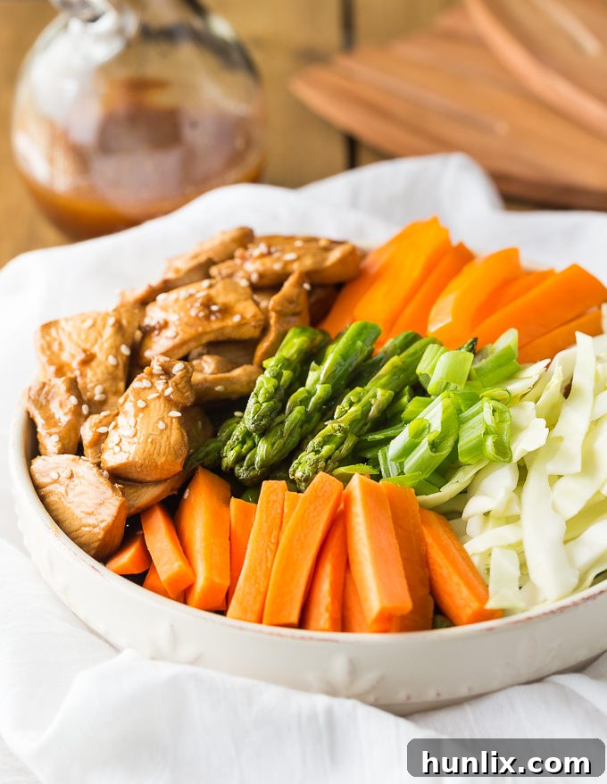 Spring Chicken and Asparagus Salad 3 Chicken & Asparagus Salad - A delicious spring salad packed with veggies, seasoned chicken and a tangy Sesame Ginger dressing.