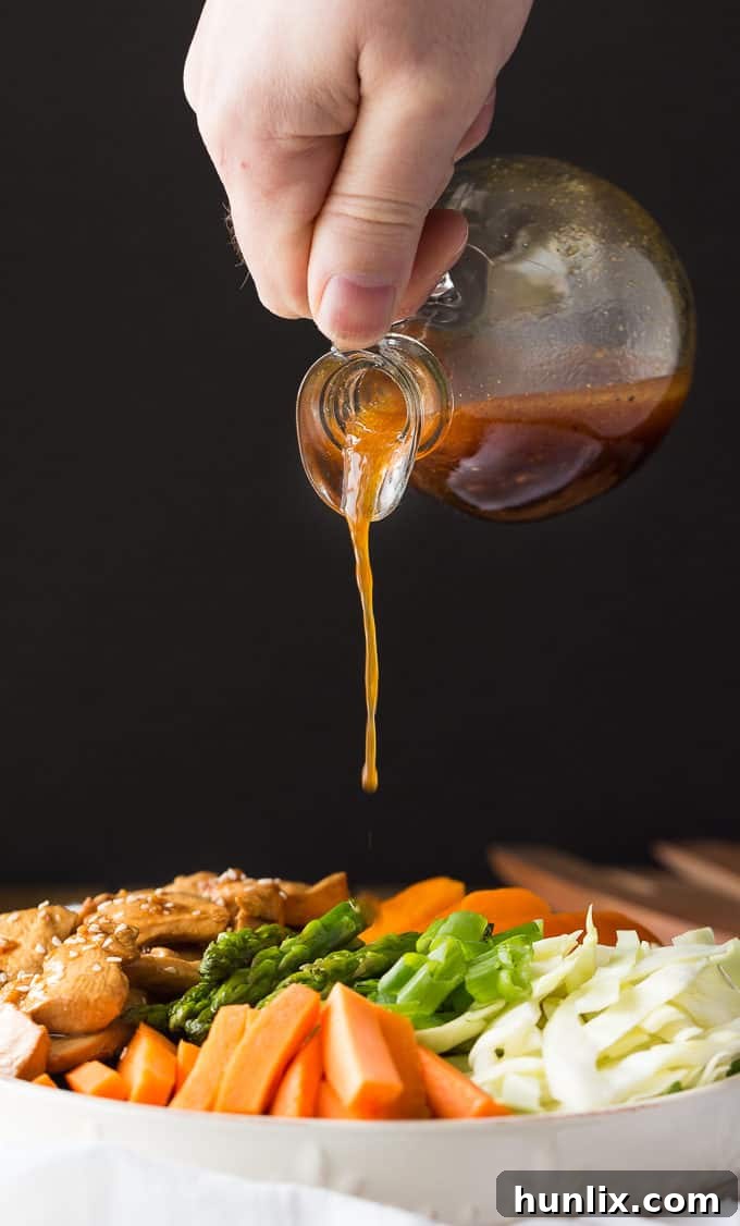 Spring Chicken and Asparagus Salad 4 Chicken & Asparagus Salad - A delicious spring salad packed with veggies, seasoned chicken and a tangy Sesame Ginger dressing.