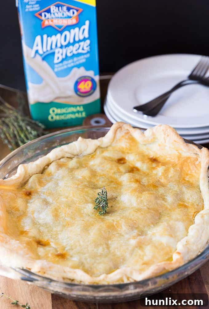 Rustic Bacon, Herb & Vegetable Pie - A hearty, dairy-free pie filled with fresh vegetables, fragrant herbs, and savory bacon, all in a luscious creamy sauce.