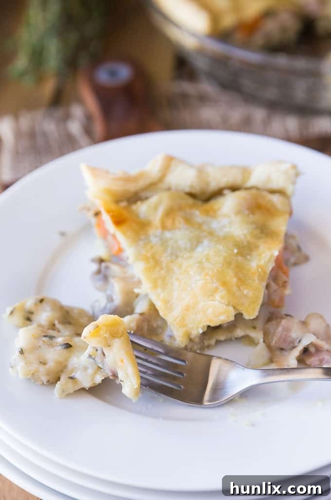 The creamy filling of the Rustic Bacon, Herb & Vegetable Pie, ready to be topped with puff pastry.