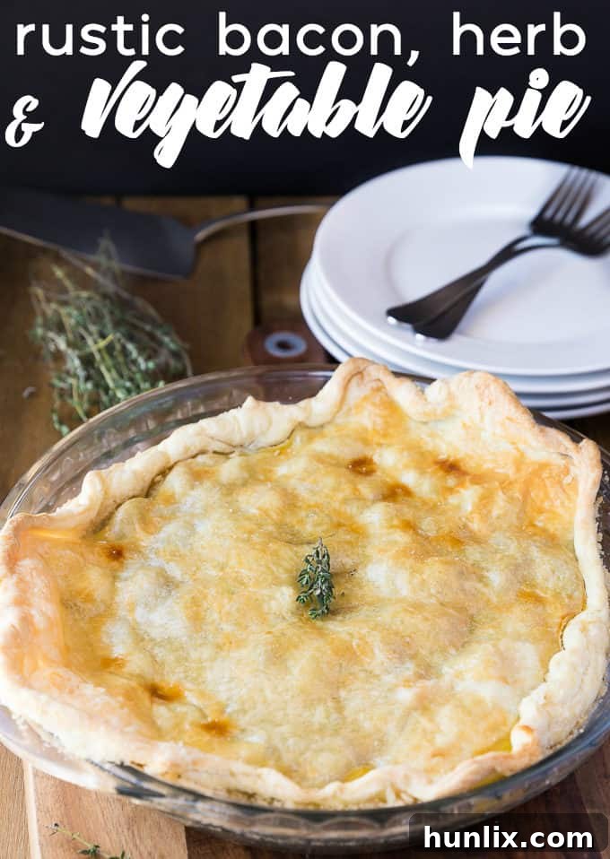 Rustic Bacon, Herb & Vegetable Pie - Detailed view of the baked pie with a golden, flaky puff pastry top.