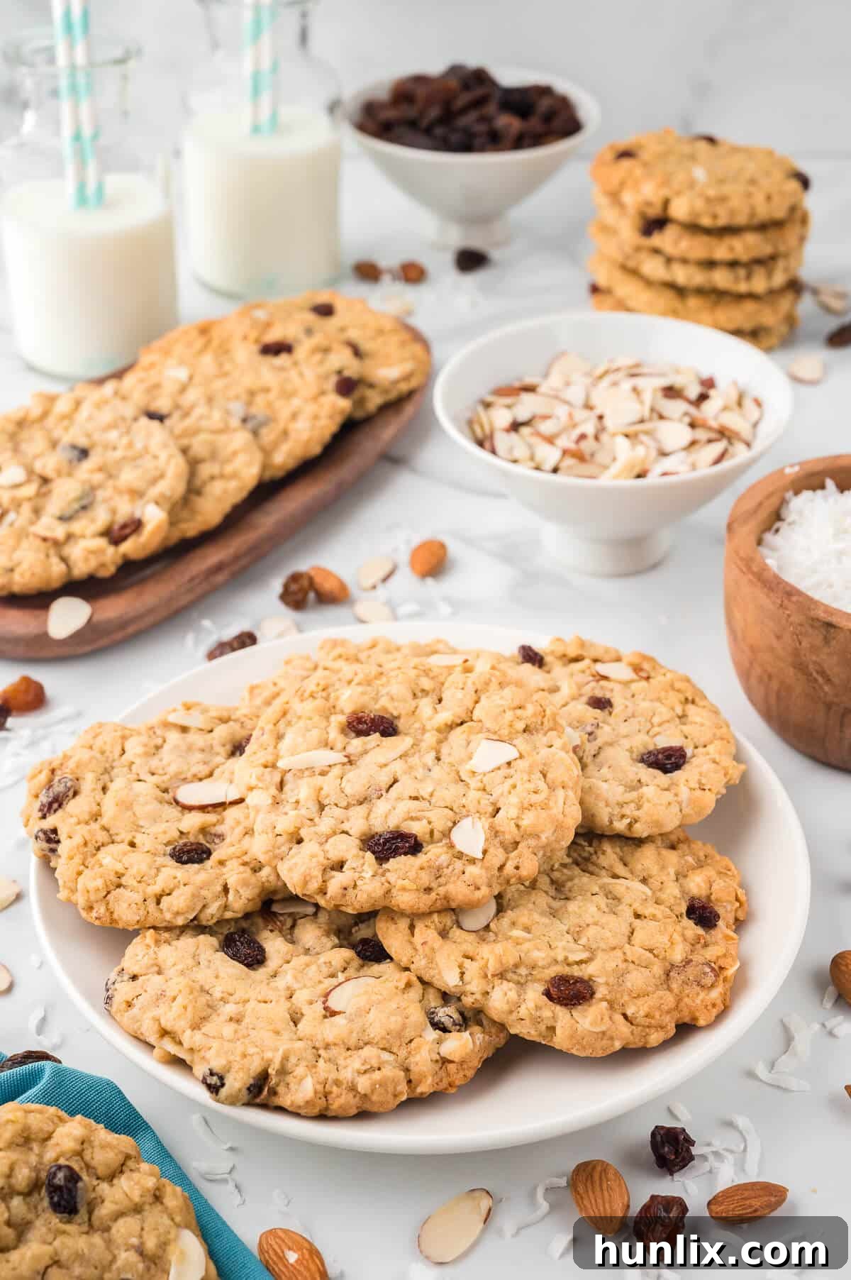 Hearty Trail Mix Oatmeal Cookies 11 A plate piled high with golden brown Trail Mix Oatmeal Cookies, showcasing their appealing texture and generous mix-ins, ready to be devoured.