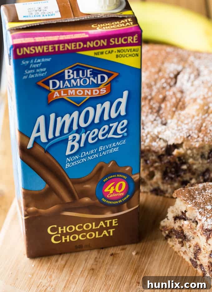 Rich, luscious Banana Chocolate Cake slices on a white plate, ready for serving.