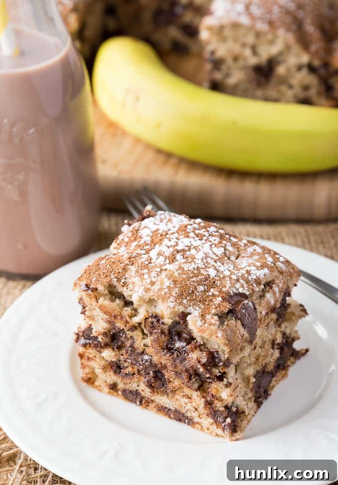 Close-up of a slice of Banana Chocolate Cake, showcasing its moist texture and chocolate chips.