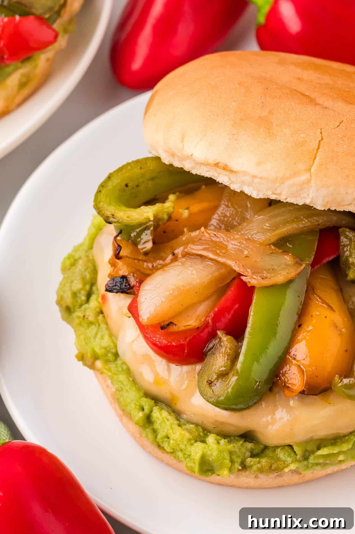 Sizzling Fajita Chicken Burgers 9 A chicken fajita burger on a plate.