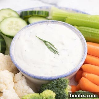 Creamy Lemon Dill Dip, perfect for fresh veggies, showcasing its vibrant color and smooth texture.
