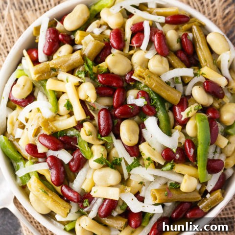 Delicious, fiber-packed bean salad with four types of beans and a homemade vinegar mustard dressing, perfect for a summer side dish.