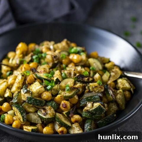 Quick and easy warm curried chickpea salad with zucchini, packed with incredible texture and flavor, perfect for meal planning.