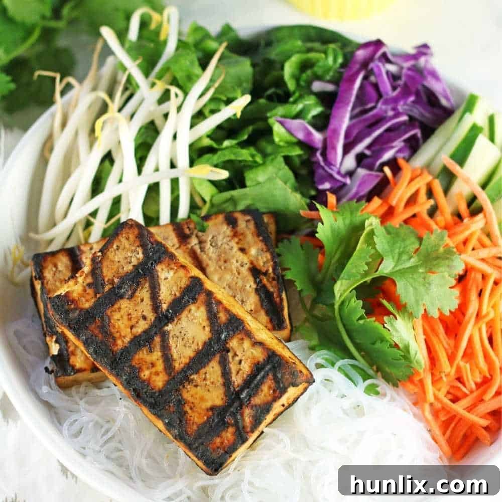 Glass Noodle Salad Bowls loaded with fresh vegetables, savory tofu, delicate glass noodles, and a tangy sauce, naturally gluten-free.
