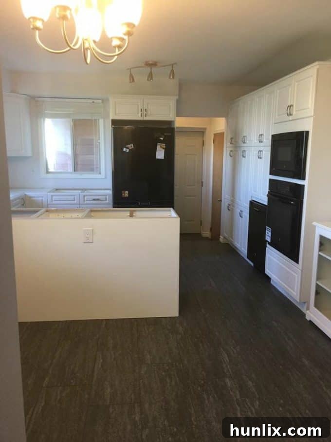 Kitchen renovation progress: Additional cabinets installed, further shaping the kitchen space