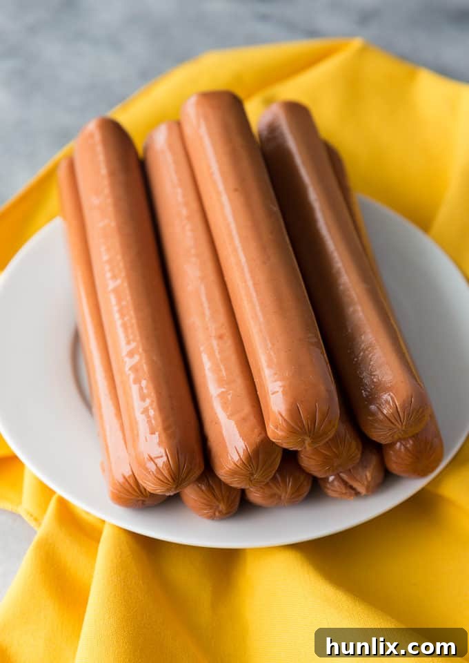 Sliced Maple Lodge Farms Spicy Ultimate Chicken Frankfurters, showing their spicy flecks, ready for the chili.
