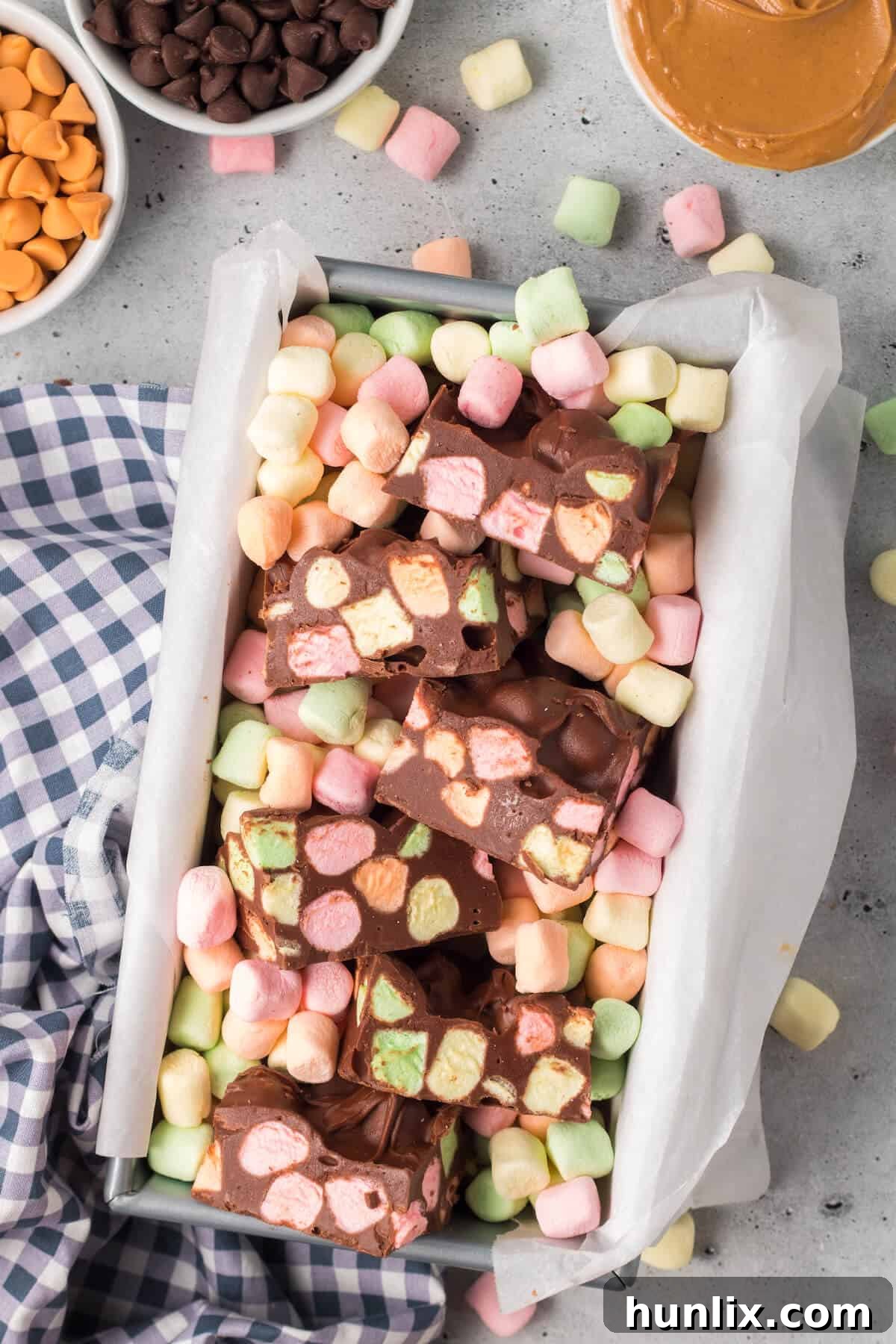 The delicious Chocolate Confetti Bars neatly cut into squares in a loaf pan.