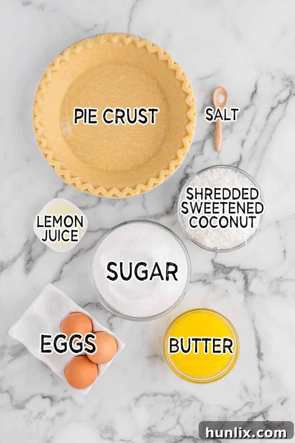 Luscious Coconut Cream Pie 3 All the simple ingredients for coconut pie laid out on a clean white counter.