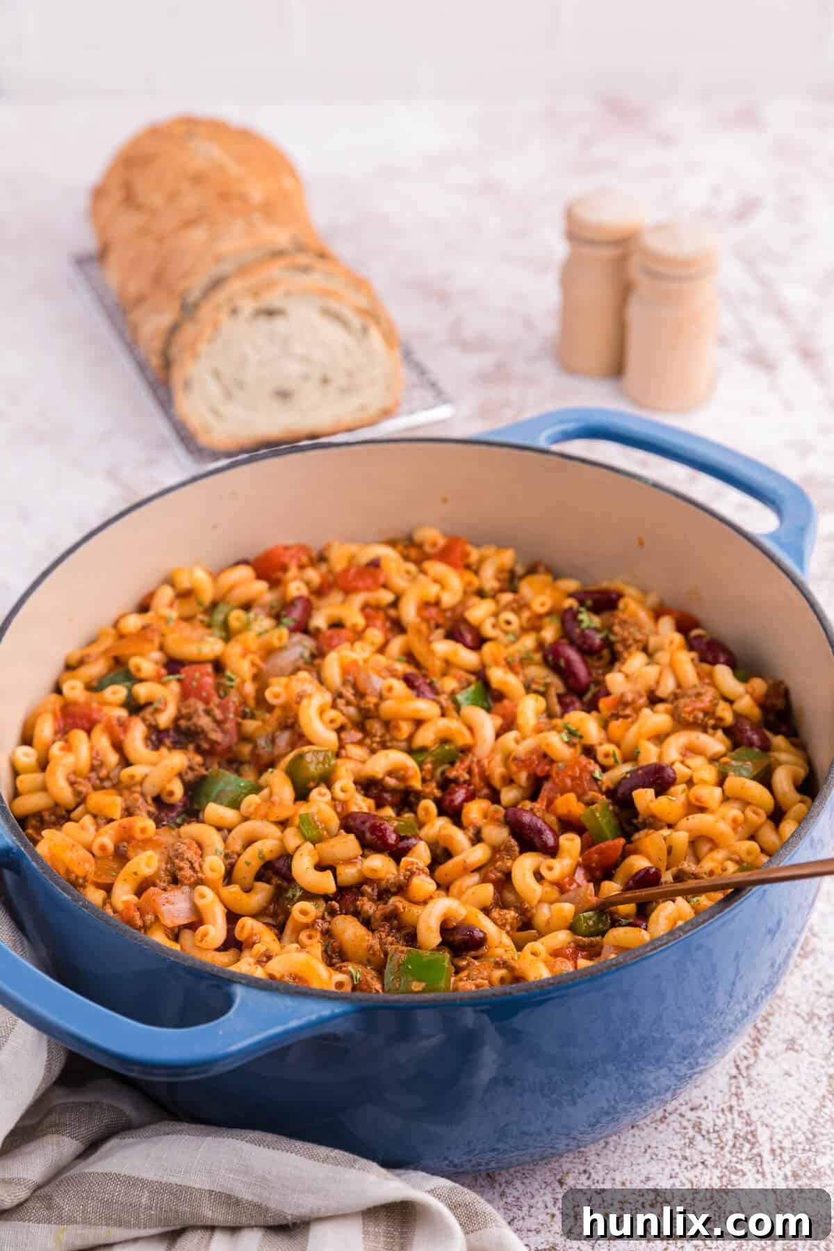 Chili Macaroni simmering in a vibrant blue pot, ready to be served.