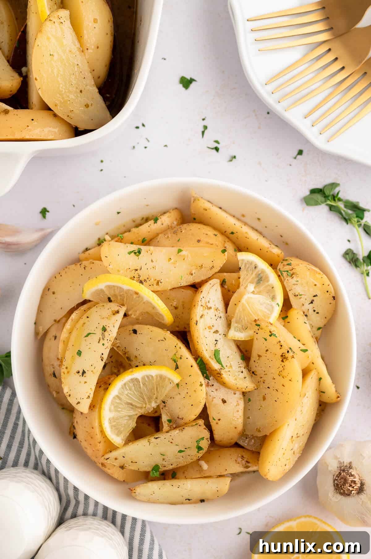 A beautifully presented bowl of lemon roasted potatoes, ready to be served.
