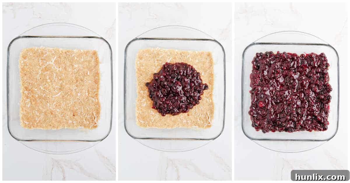 Blueberry Brittle Bake 5 Second step of making Blueberry Crackle Cake: showing the cracker mixture being pressed into the bottom of a baking pan.