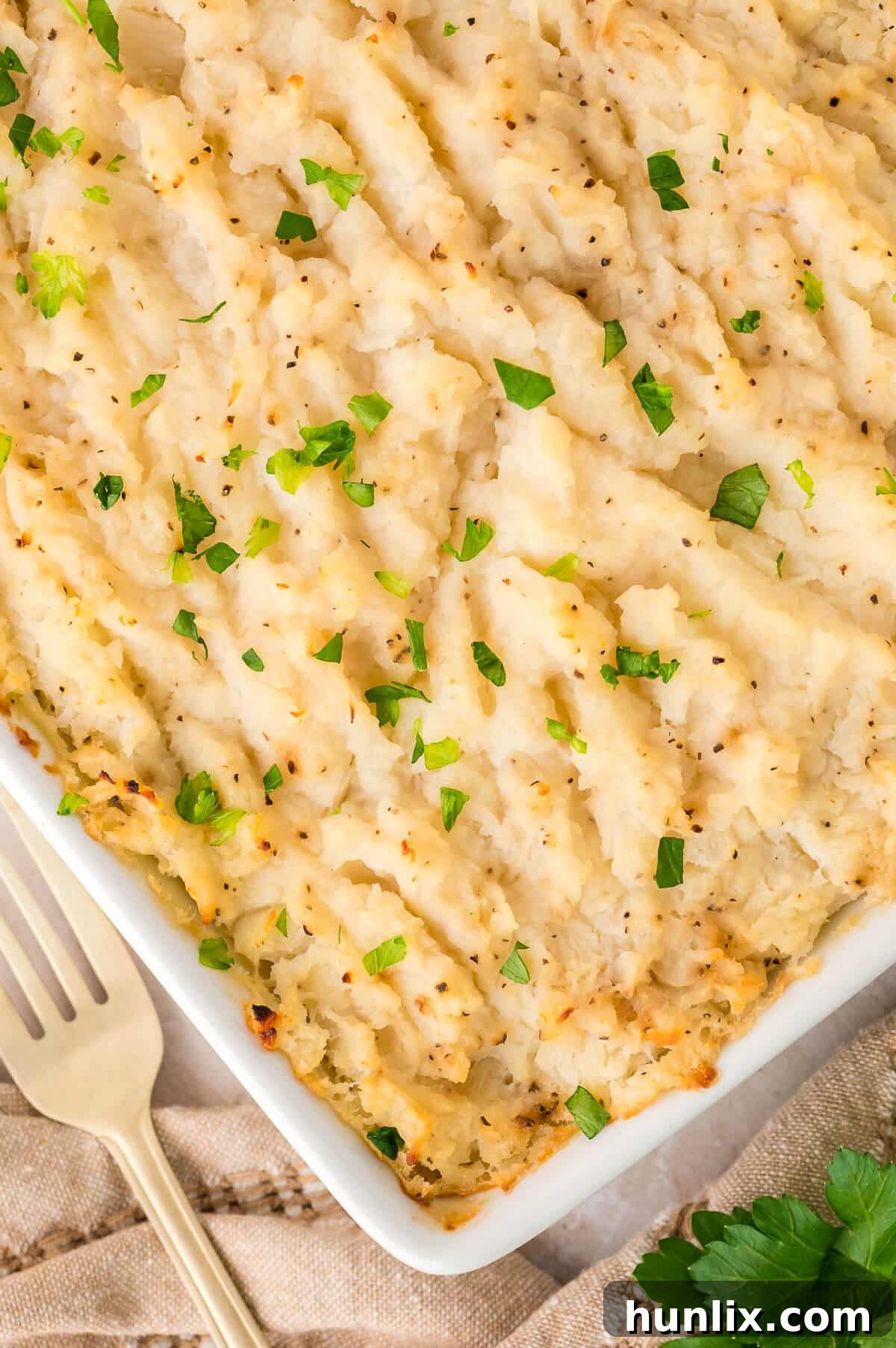 Golden Turnip Delight 2 Creamy, golden turnip casserole in a white baking dish, ready to serve.