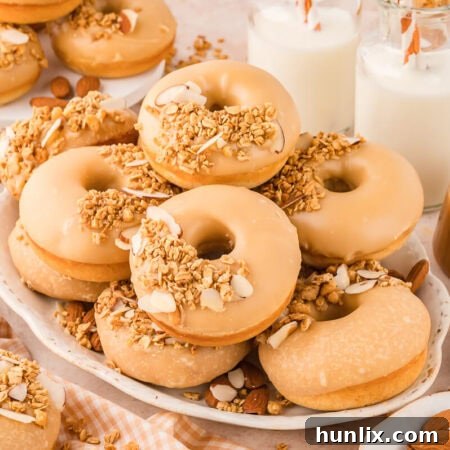 A pile of donuts on a platter.