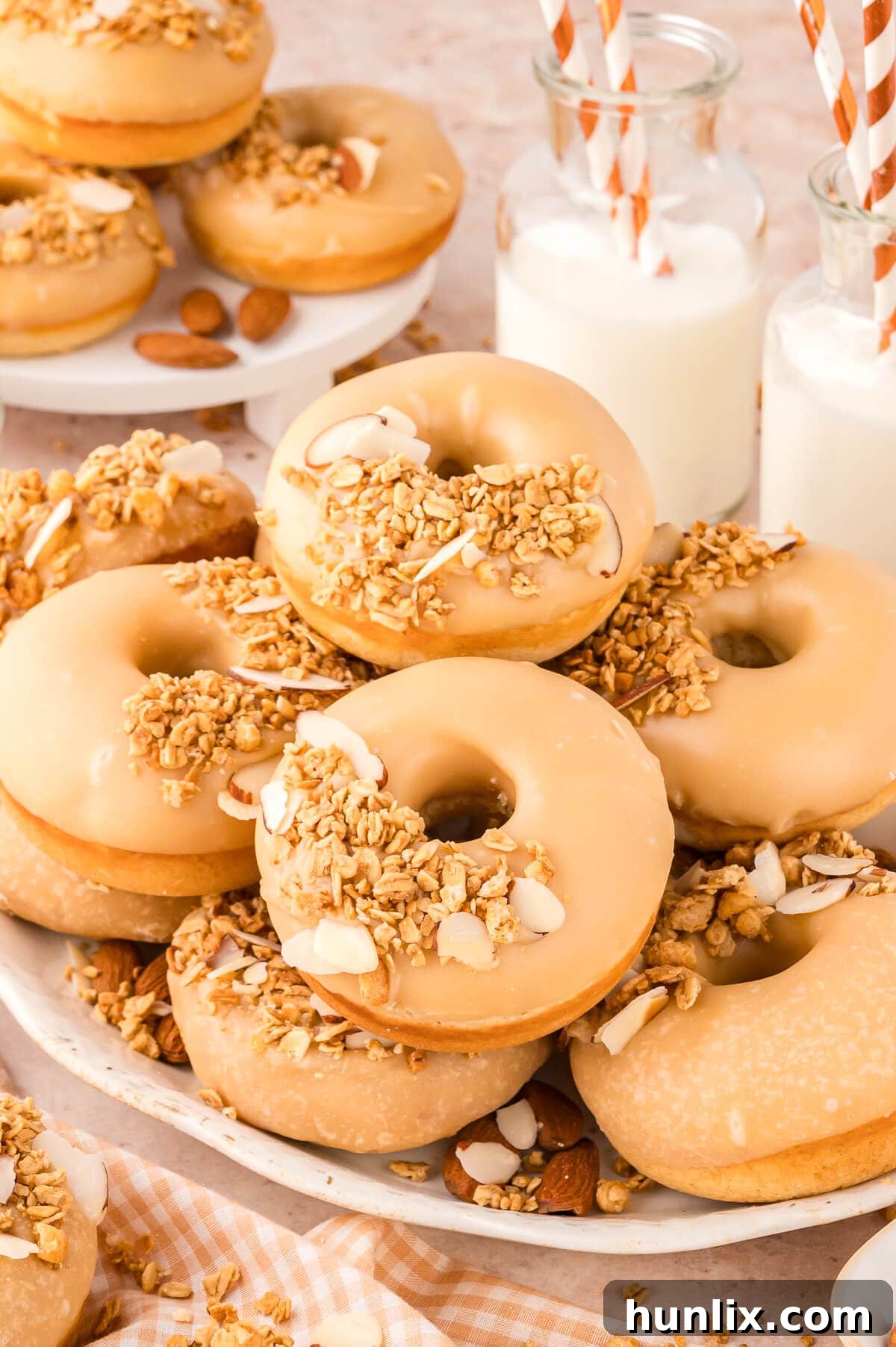 A pile of donuts on a platter.