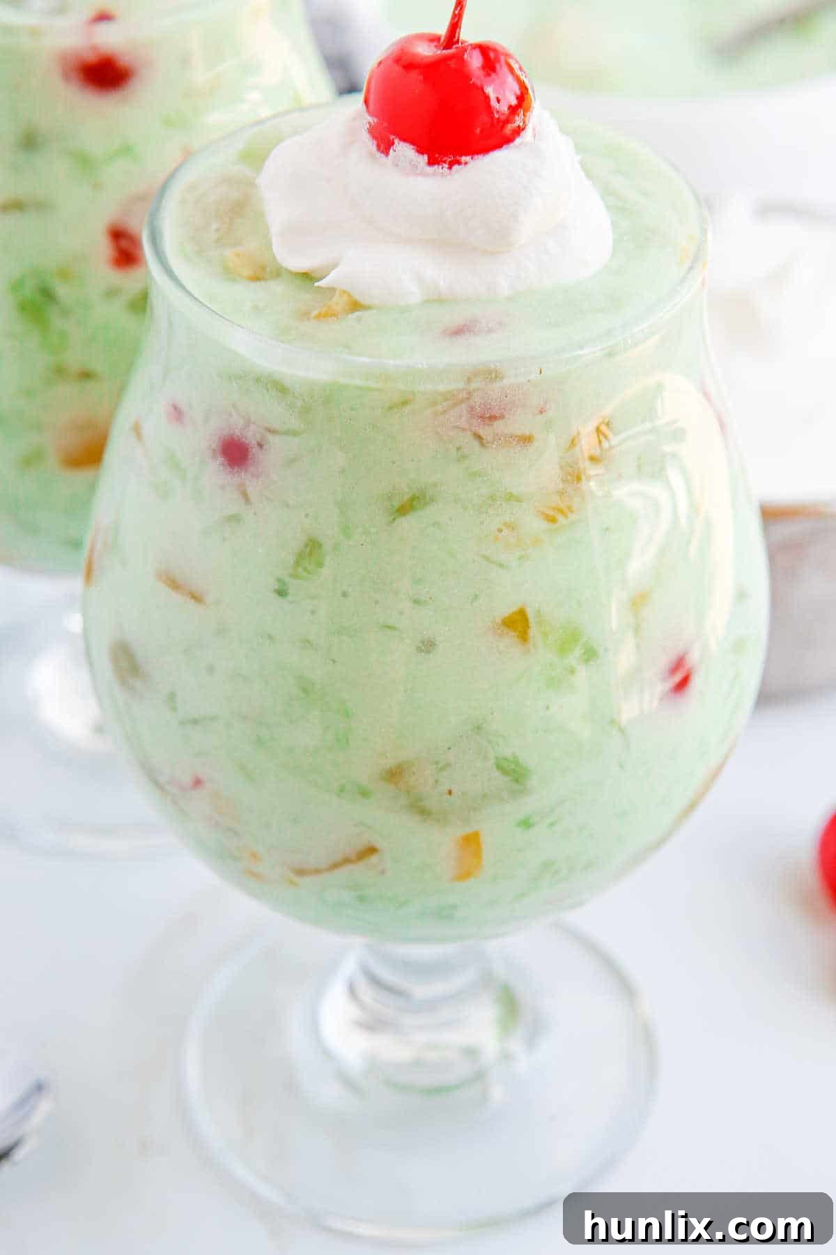 Vibrant Fruit Delight 6 Fruit cocktail dessert in a parfait dish.