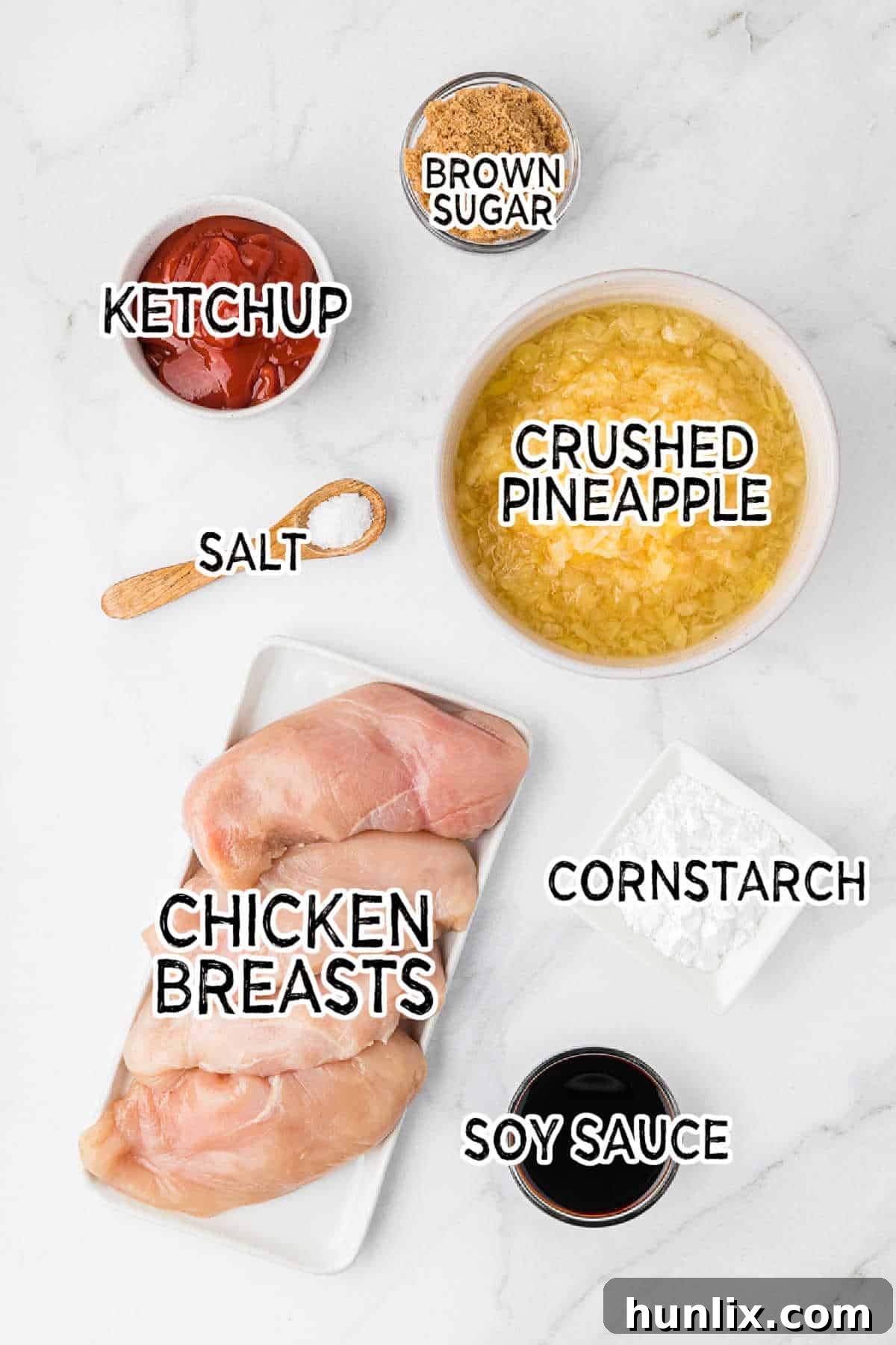 Island Style Chicken 3 Ingredients laid out for making Hawaiian chicken, including pineapple, ketchup, soy sauce, and chicken breasts.
