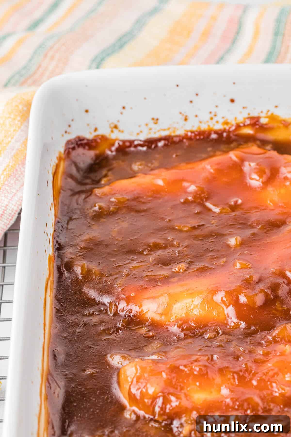 Island Style Chicken 6 Hawaiian chicken baked in a casserole dish, garnished with fresh green onions.