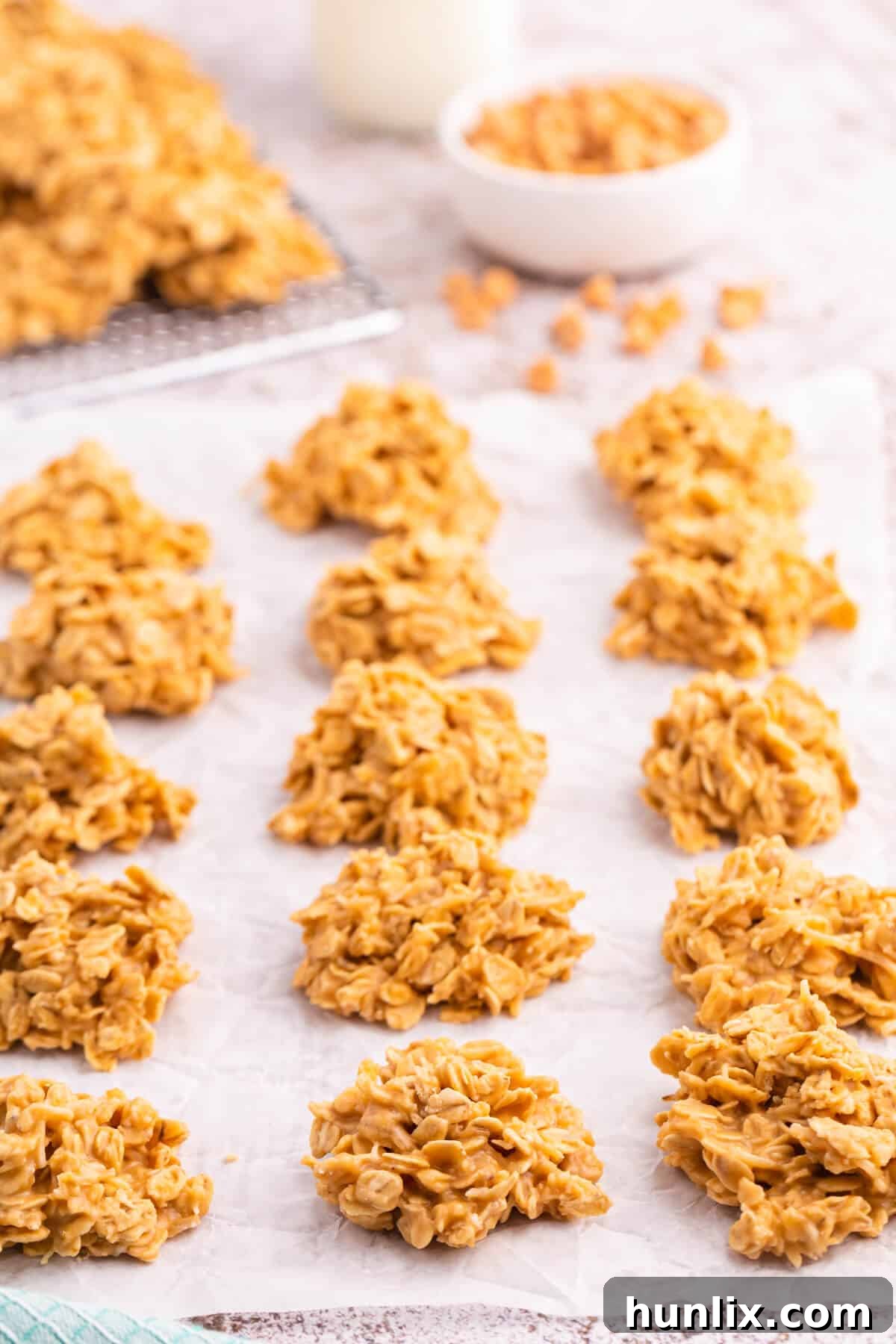 Effortless Butterscotch Treats 2 Delightful no-bake butterscotch cookies arranged neatly on parchment paper, ready to be enjoyed.
