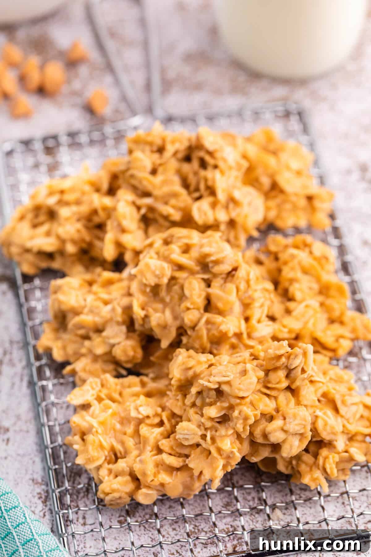 Effortless Butterscotch Treats 4 A batch of freshly made No-Bake Butterscotch Cookies cooling on a wire rack, showcasing their inviting texture.
