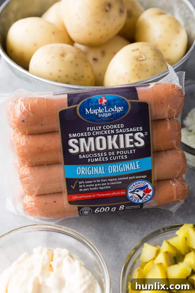 German Comfort Plate: Sausage and Potato Salad 3 A close-up of German Sausage & Potato Salad, showcasing its creamy texture and chunks of chicken sausage and dill pickles.