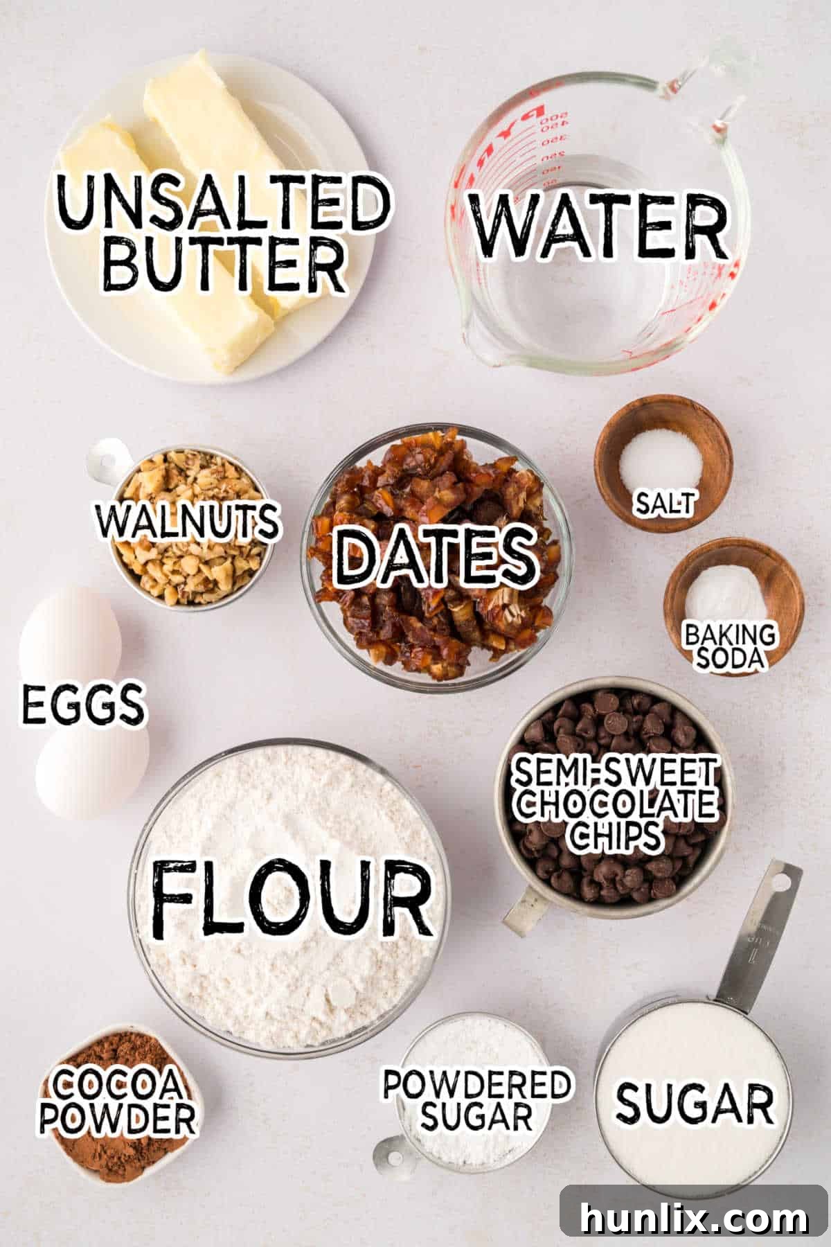 Mystery Chocolate Bars 3 Various ingredients for chocolate surprise bars laid out on a white surface.