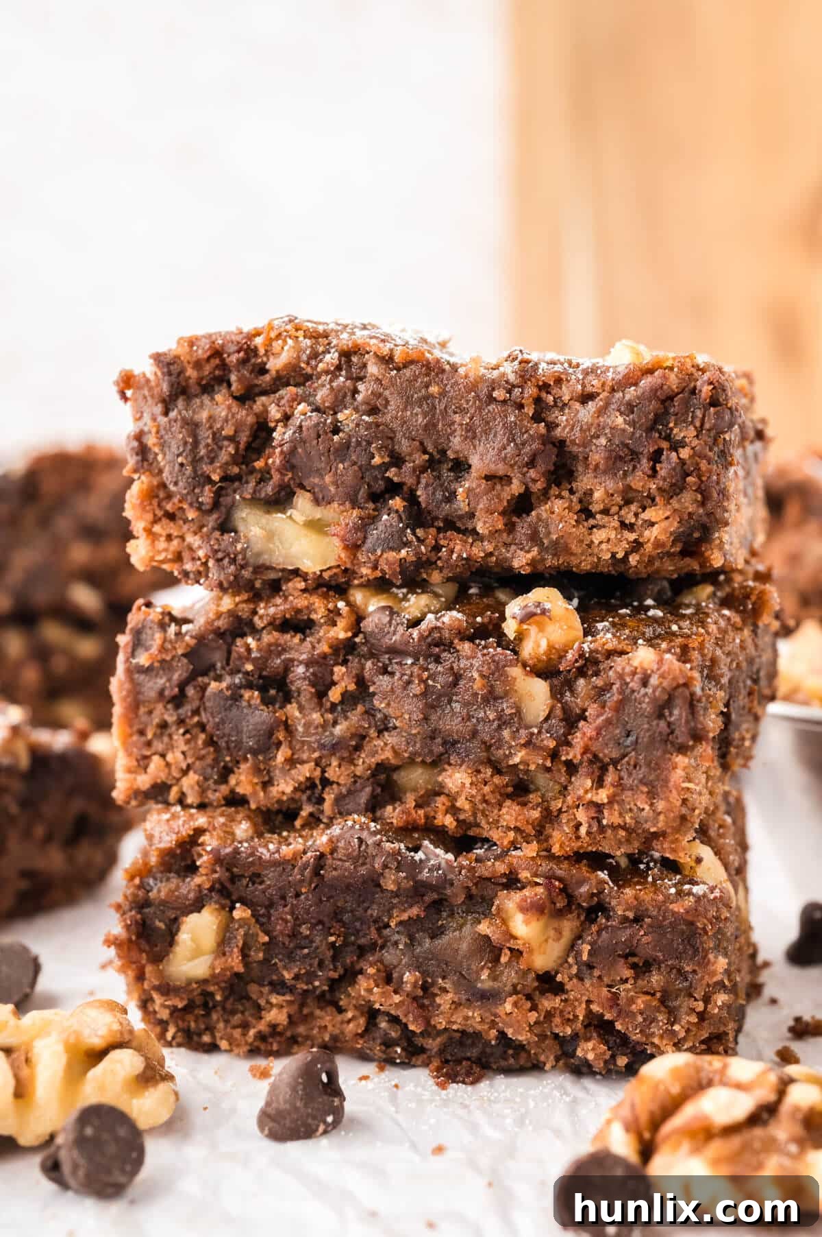 Mystery Chocolate Bars 7 A stack of rich, fudgy Chocolate Surprise Bars dusted with powdered sugar.