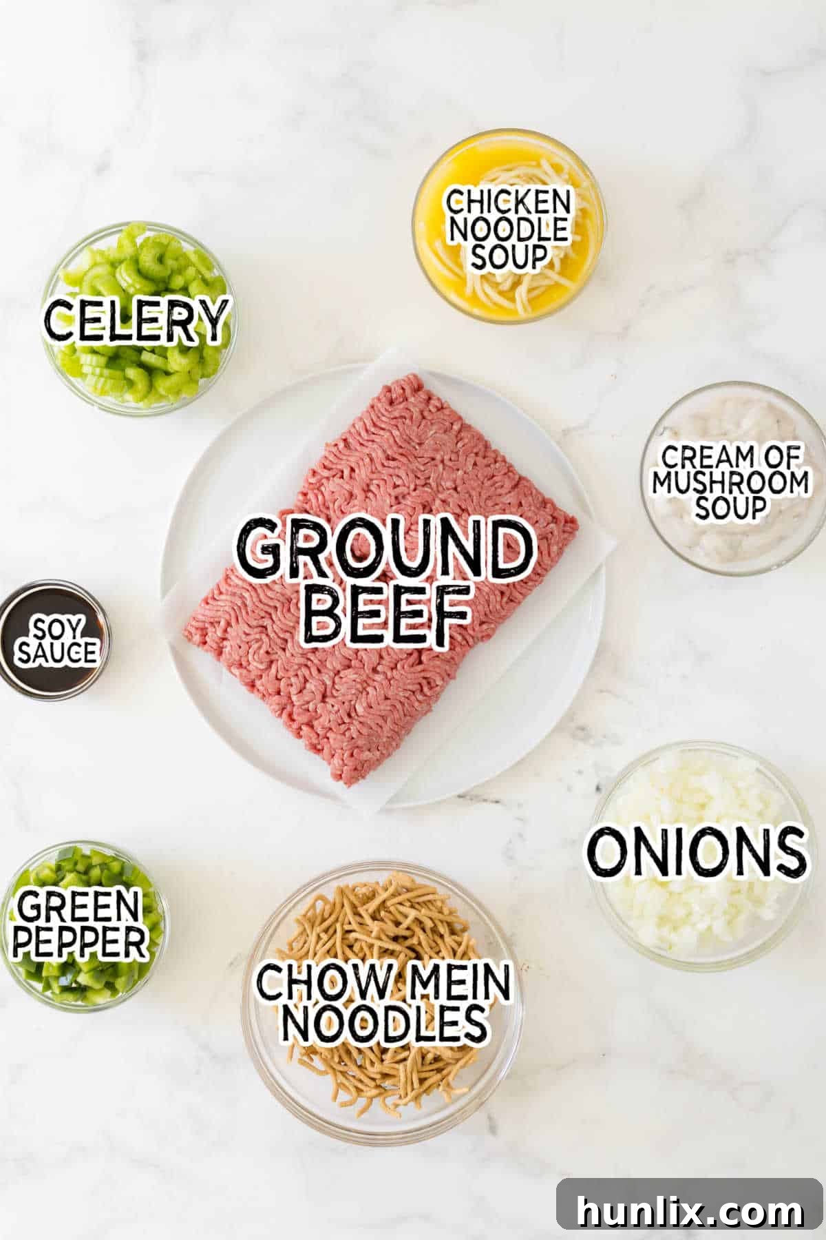 One-Pan Chow Mein 3 All the fresh ingredients for Chow Mein Skillet laid out on a cutting board, including ground beef, chopped celery, onions, green pepper, canned soups, and soy sauce.