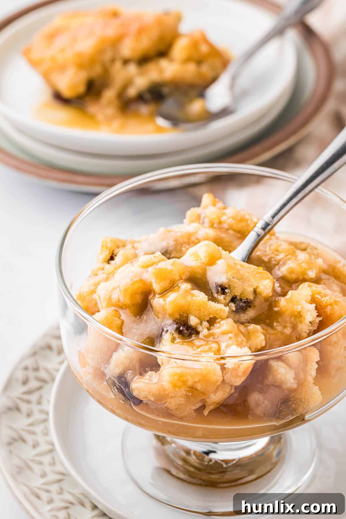 Radio pudding served in a parfait dish with a spoon, ready to be enjoyed.