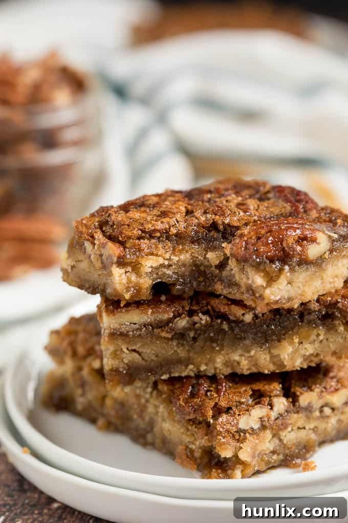 A beautifully arranged stack of maple pecan squares, showcasing their delicious layers.