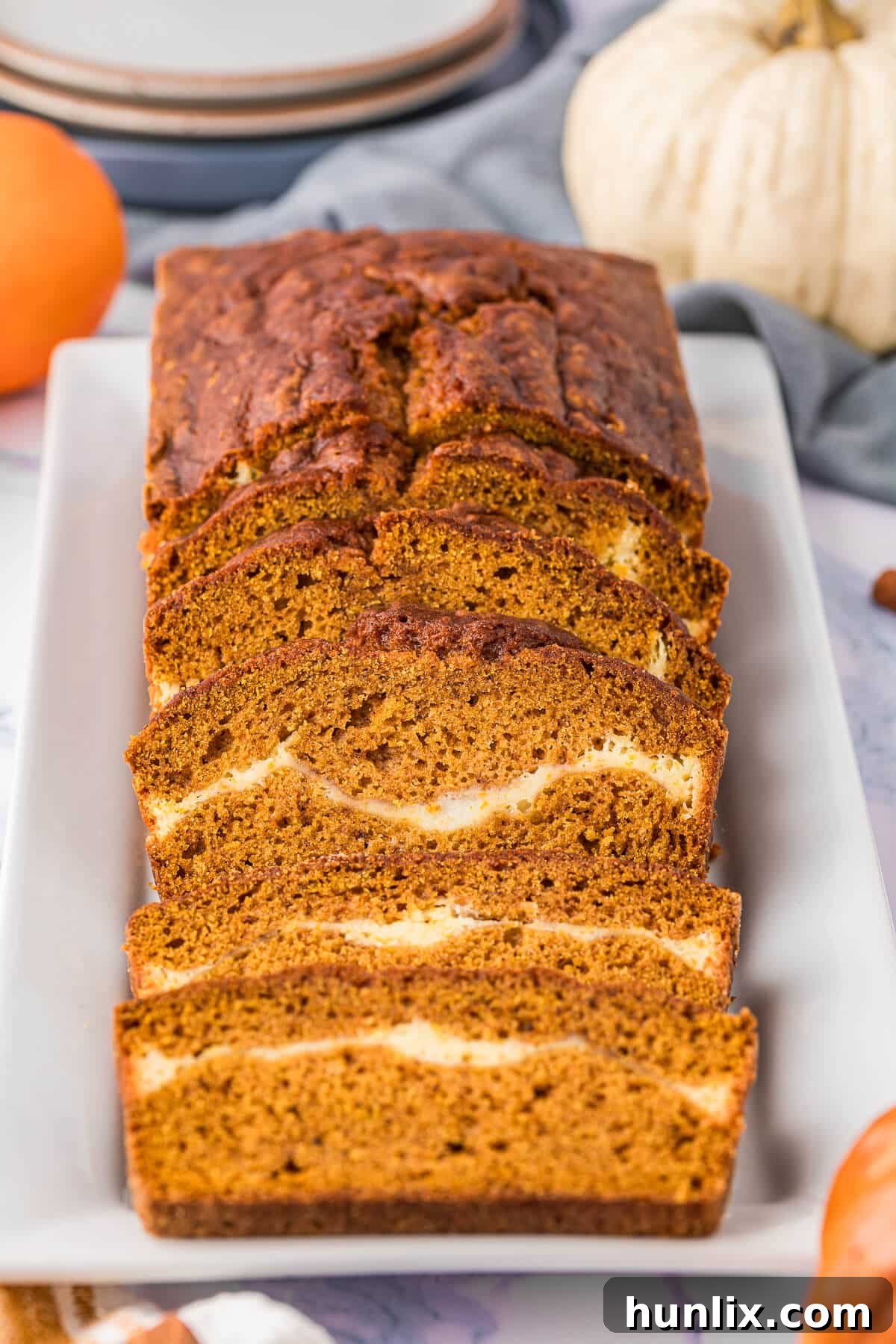 Beautifully sliced pumpkin ribbon bread arranged on an elegant platter.