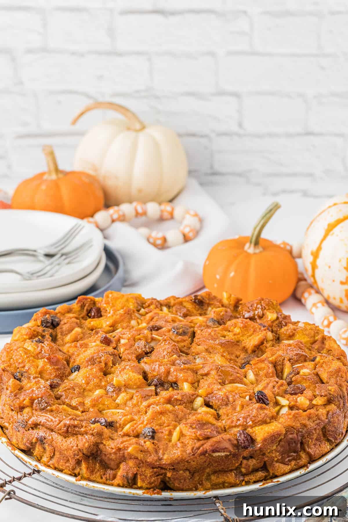 Delicious Pumpkin Bread Pudding on a platter, ready to be served for Thanksgiving and other fall gatherings.
