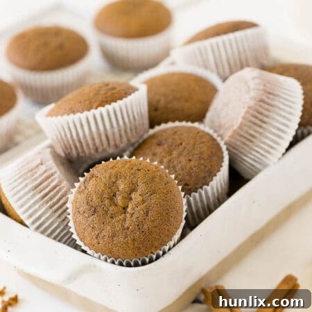 Muffins in a white container.