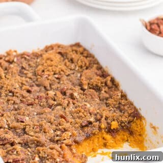 Golden Sweet Potato Delight 11 Sweet potato casserole with servings out of it