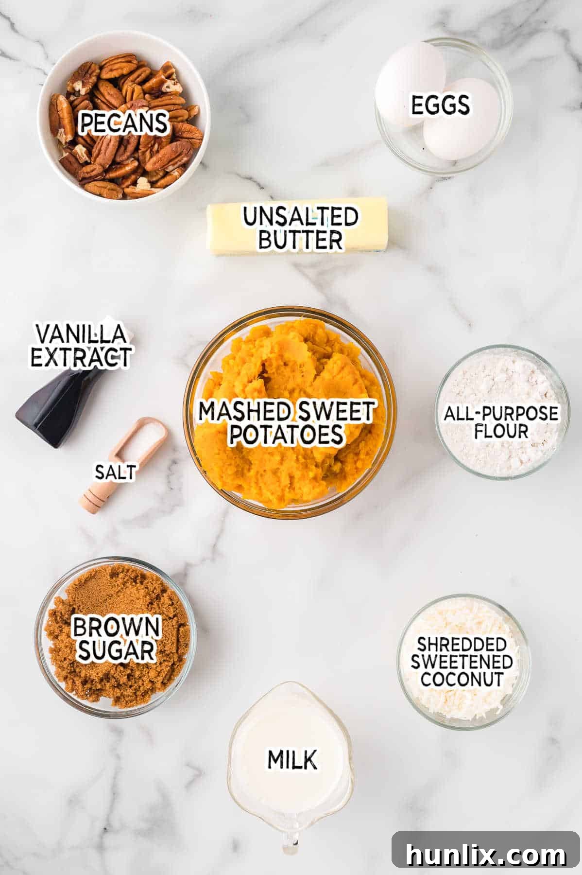 Golden Sweet Potato Delight 3 A selection of fresh ingredients laid out for making sweet potato casserole.