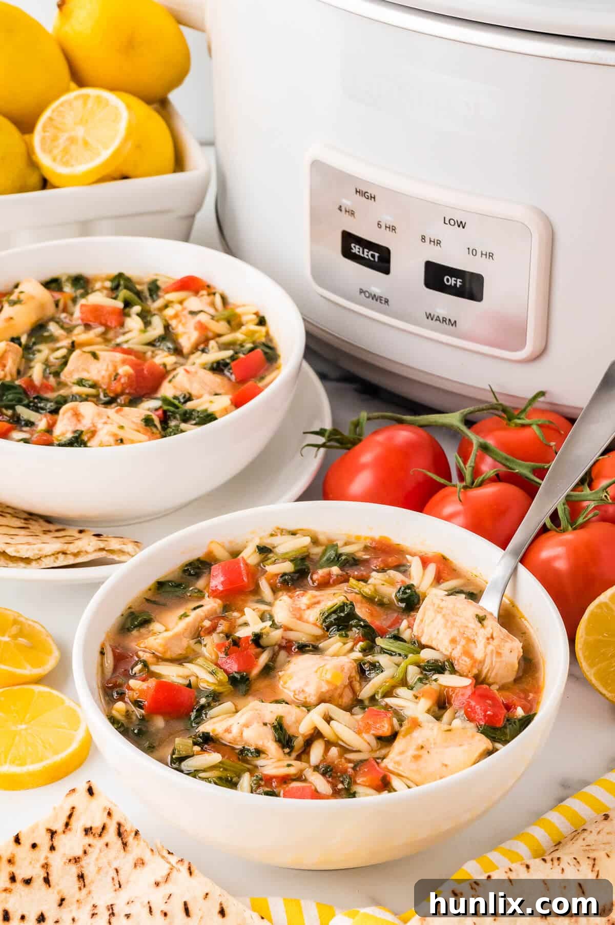 A steaming bowl of Greek Chicken Orzo Soup ready to be enjoyed.