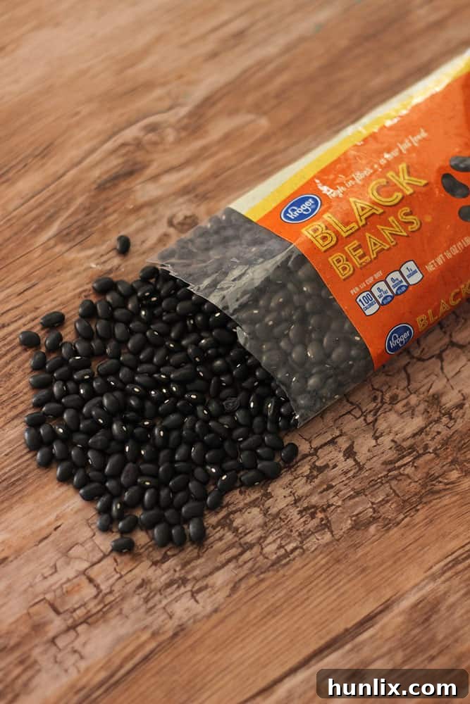 Serve up these easy Slow Cooker Black Beans! A gluten free and vegetarian recipe that is so simple to make. If you want to cook dried black beans this recipe is perfect for you.
