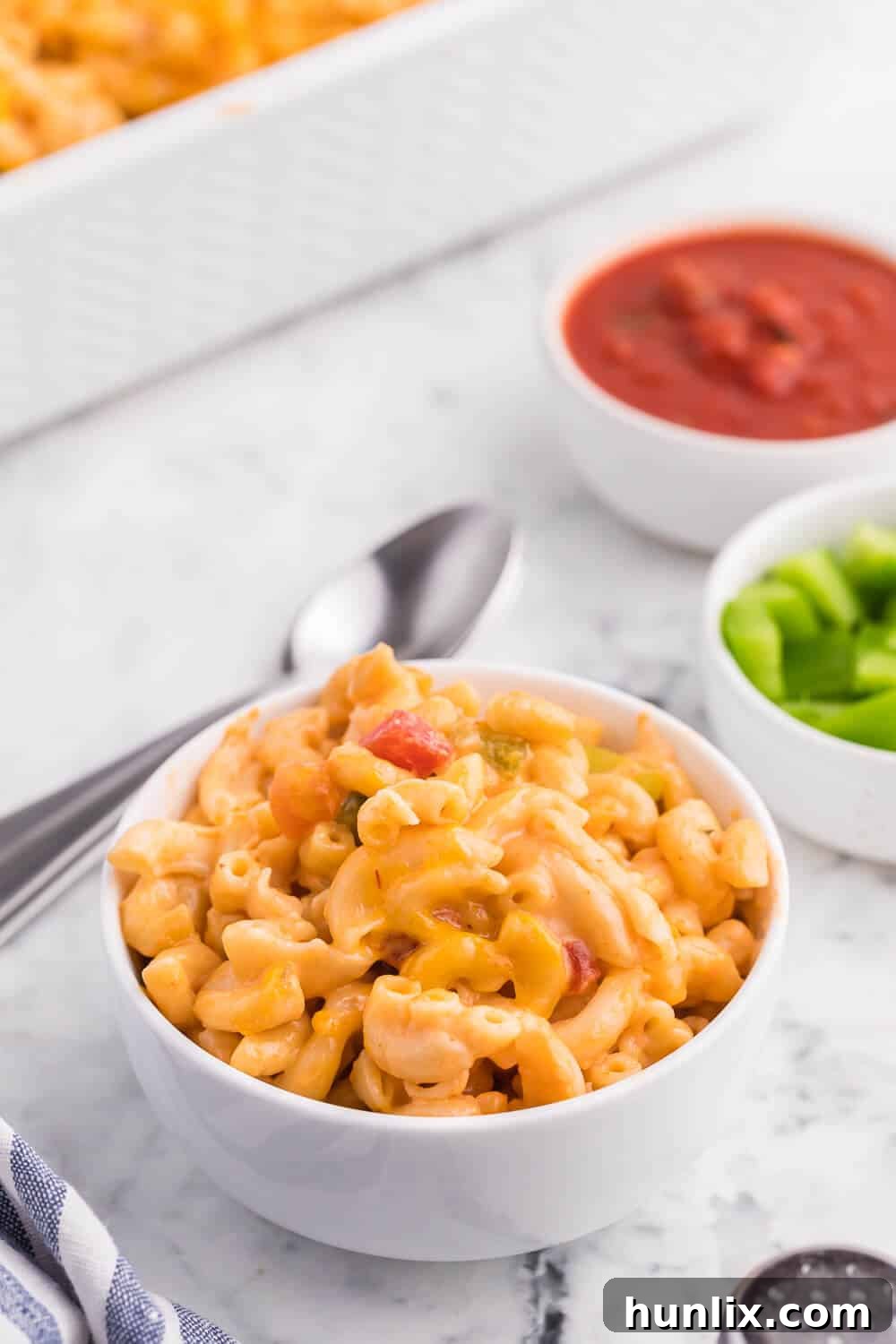 Fiesta Mac & Cheese 5 Salsa Macaroni & Cheese - Classic mac and cheese with a Tex Mex twist! Spice levels can be controlled by using medium or hot salsa, which is a great compliment to the cheesy, creamy sauce.