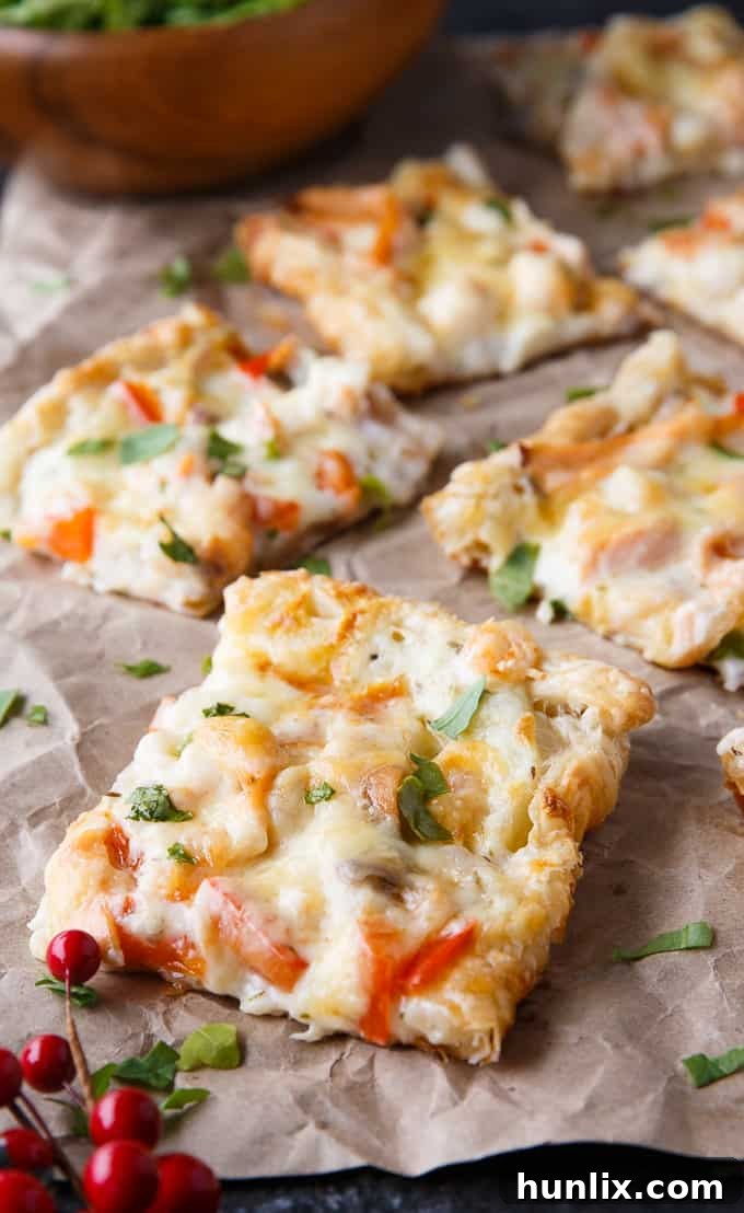 Ocean's Bounty Pizza 12 A slice of Festive Seafood Pizza, showcasing the varied seafood toppings and golden crust.