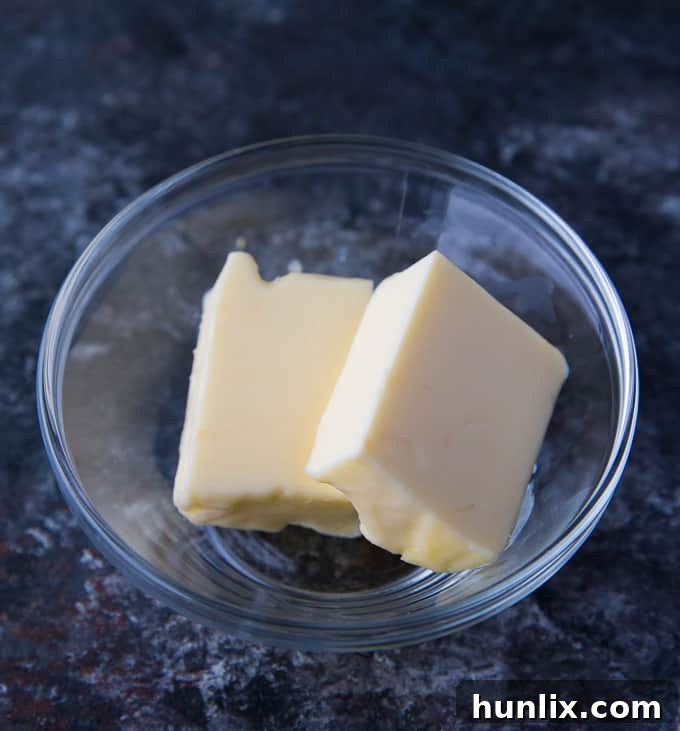 Ocean's Bounty Pizza 6 Unsalted butter, an essential ingredient for the creamy sauce of the Festive Seafood Pizza.