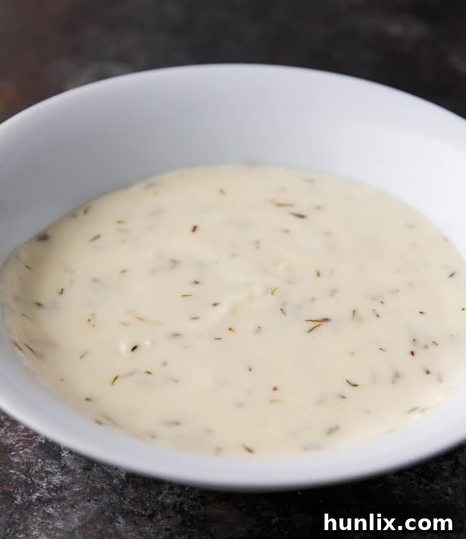 Ocean's Bounty Pizza 8 A close-up shot of the perfectly smooth and creamy milk sauce before being spread on the pizza crust.