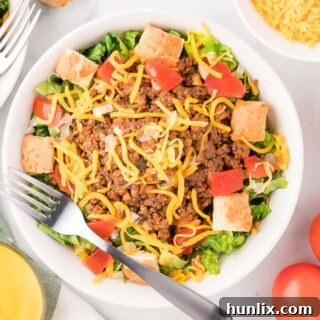Cheeseburger in a Bowl 11 A bowl of Cheeseburger Salad with a fork, ready to be eaten.