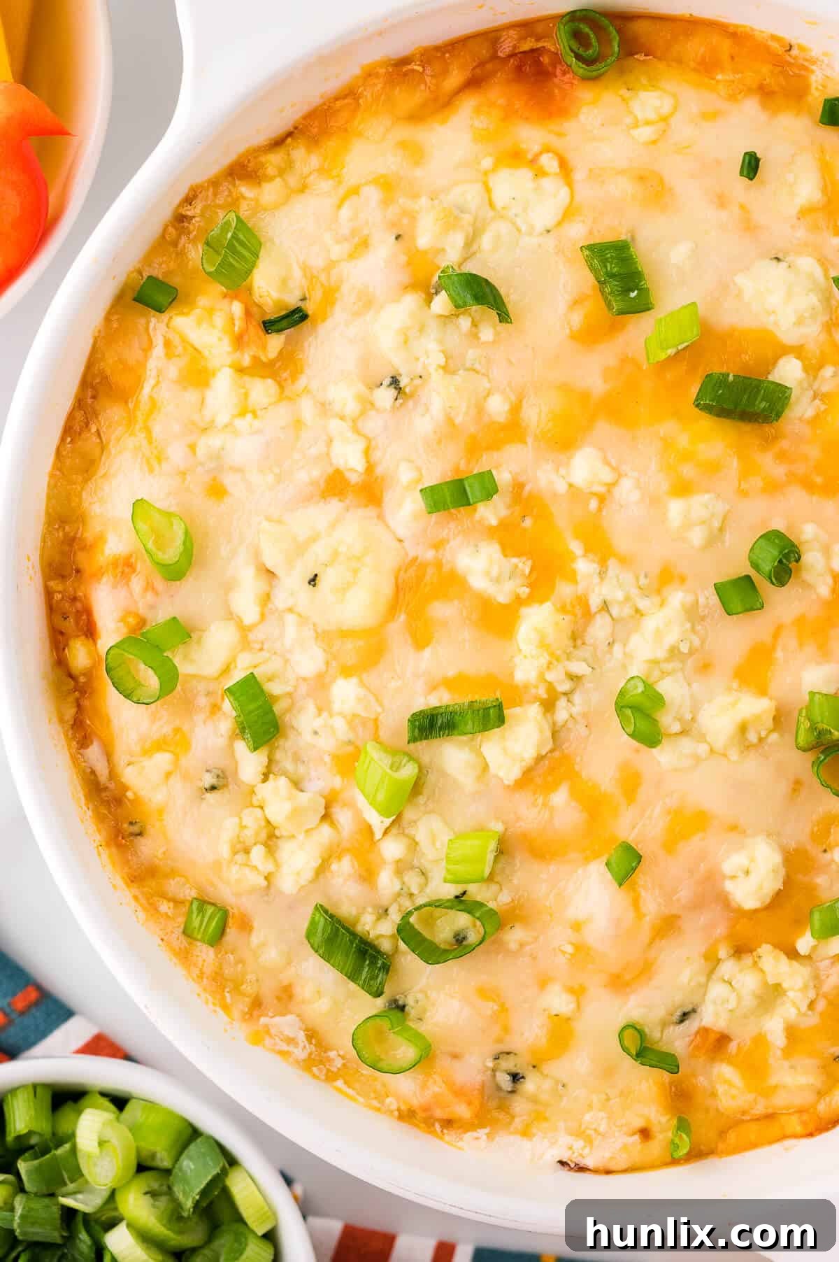 Buffalo chicken dip in a white dish.