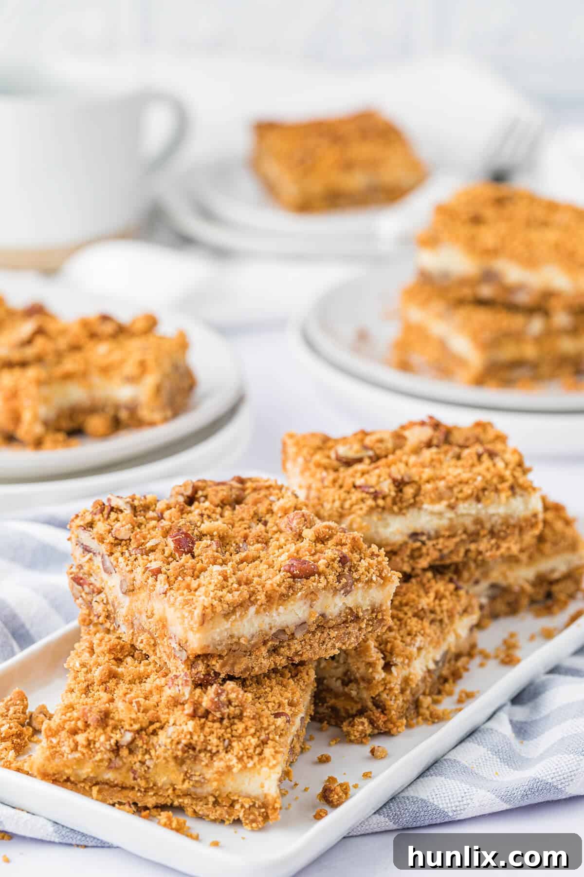 Dreamy Butterscotch Cheesecake Squares 9 A group of butterscotch cheesecake bars arranged artfully on a platter, ready for serving.