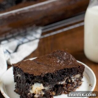 A piece of cake on a plate.